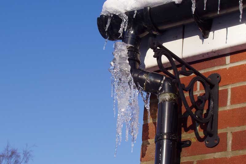 Frozen pipes on the exterior of a house